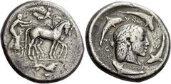 Greek Coins Syracuse Decadrachm of the Demareteion series circa 465, AR 43.02 g. Slow quadriga driven r. by charioteer, wearing chiton, holding reins in both hands and kentron in l.; above, Nike flyin