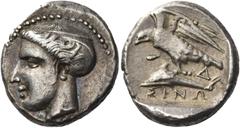 Greek Coins Greek Coins. Sinope. Drachm circa 410-350, AR 6.08 g. Head of nymph l., hair caught up in saccos. Rev. ΣINΩ Eagle, with spread wings, standing l. on dolphin; in r. field, Δ. All within sha