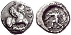 Part I Greek coins Elis Stater circa 440, AR 12.39 g. Eagle flying r., grasping hare with its talons and tearing at it with its beak. Rev. F – A Nike striding l., holding wreath in r. hand and rising 