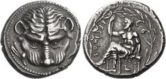 Greek Coins. Bruttium, Rhegium. Tetradrachm circa 435-425, AR 17.30 g. Lion's mask facing; in l. field, olive twig. Rev. RECINOΣ retrograde Apollo Iocastus seated l., himation over lower limbs; r. han