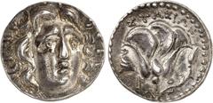 LE MONDE GREC Iles de Carie Rhodes. Tétradrachme frappé sous le magistrat Stasion vers 205-190 av. J.-C. Tête rayonnante d'Hélios de face, légèrement tournée vers la droite / Rose avec un bourgeon à d