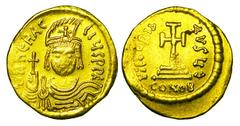 BYZANTINE EMPIRE. Heraklios, 610-641 AD. Gold Solidus (4.45 gm) of Constantinople. Facing bust wearing a plumed helmat / Cross potent on three steps. S.731. VF+. Scarce.