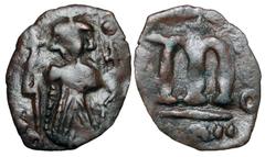 BYZANTINE EMPIRE. Constans II, 641-668 AD. Æ Follis (1.70 gm) of Constantinople, yr. 2. Emperor standing / Large m. S.1000. Uneven VF, brown patina.