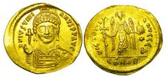 BYZANTINE EMPIRE. Justinian I, 527-565 AD. Gold Solidus (4.35 gm) of Constantinople. Helmeted bust facing / Angel standing. S.140. XF, graffitti. [Est. $700]