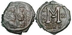 BYZANTINE EMPIRE. Justin II, 565-578 AD. Æ Follis (12.86 gm) of Nikomedia, yr. 10 B. Justin and Sophia enthroned / Large M. S.369. VF+, brown patina. ex. Khristov coll. [Est. $250]