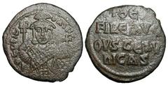 BYZANTINE EMPIRE. Theophilus, 829-842 AD. Æ Follis (3.88 gm) of Constantinople. Three-quarter figure standing holding labarum and orb / Inscription. S.1667. Uneven VF, olive brown patina. Scarce. [Est