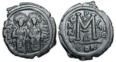 BYZANTINE EMPIRE. Justin II, 565-578 AD. Æ Follis (15.37 gm) of Constantinople, yr. 9. Justin and Sophia enthroned facing / Large M, Christogram above. S.360. XF, brown black patina. [Est. $300]