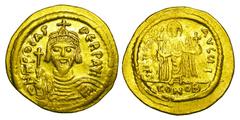 BYZANTINE EMPIRE. Phokas, 602-610 AD. Gold Solidus (4.40 gm) of Constantinople. Crowned bust facing / Angel standing. S.620. Off. I. Near Mint [Est. $750]