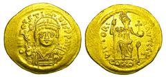 BYZANTINE EMPIRE. Justin II, 565-578 AD. Gold Soldus (4.49 gm) of Constantinople, off.E. Helmeted bust facing / Constantinopolis seated. S.345. Near Mint.