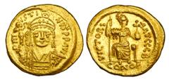 BYZANTINE EMPIRE. Justin II, 565-578 AD. Gold Solidus (4.46 gm) of Constantinople. Helmeted bust facing / Consantinopolis seated. S.344. Near Mint.