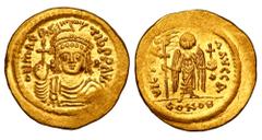BYZANTINE EMPIRE. Maurice Tiberius, 582-602 AD. Gold Light-Weight Solidus (4.22 gm) of 23 Siliqua, Constantinople. Bust wearing plummed helmet and holding globus cruciger, star / Angel with long staff
