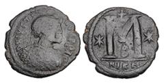 Byzantine Coins BYZANTINE EMPIRE. Justin I, 518-527 AD. Æ Follis (14.87 gm) of Nikomedia, off. B. Diademed bust / Large M. S.83. aVF, black patina.