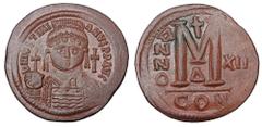 Byzantine Coins BYZANTINE EMPIRE. Justinian I, 527-565 AD. Æ Follis (21.32 gm) of Constantinople, Off D, yr.12. Crowned bust right / Large M. S.163. aXF, brown patina. Scarce.