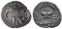 Greek Sicily, Akragas, c. 420-410 BC. AR Litra (13.5mm, 0.70g). Eagle standing l., cluthing hare in talos. R/ Crab; A above; below, fish (perch) r. Westermark, Coinage, 606; HGC 2, 115. Very Rare, VF