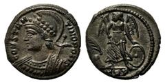 Monete romane imperiali / The Roman Empire Costantino I (306-337), Nummus, Treviri, AE, (g 3,31, mm 15, h 6). Testa elmata di Costantinopoli a s., Rv. Vittoria stante verso s.. RIC 563. Tracce di arge