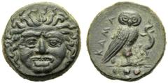 Sicily, Tetras,Kamarina, c. 420-410 BC, AE, (g 3,24, mm 14, h 10). Gorgoneion, Rv. KAMA, owl standing r., holding lizard; in ex. three pellets. CNS III, n. 19; SNG ANS 1121-1124.Beautiful style . Lig