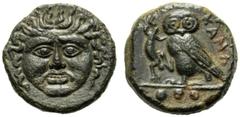 Sicily, Tetras,Kamarina, c. 425-405 BC, AE, (g 2,75, mm 13, h 6). Gorgoneion, Rv. KAMA, owl standing l., holding lizard with claws; in ex. three pellets. CNS III, n. 20; SNG ANS 1225.Dark patina. Goo