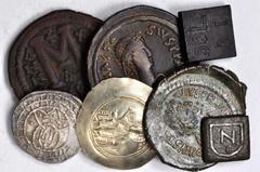 MIXED LOTS MIXED LOTS. Byzantine Issues, ca. A.D. 491-1448. VERY FINE. 7 pieces in lot. Includes two Bronze Coin weights, three AE Folles, an EL Histamenon Nomisma and a late empire AR Hyperpyron. A n