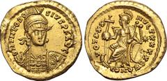 Maritime Theodosius II AV Solidus. Constantinople, AD 430-440. D N THEODOSIVS P F AVG, pearl-diademed, helmeted and cuirassed bust facing slightly to right, holding spear and shield decorated with hor