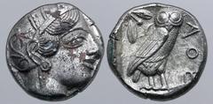 Greek Attica, Athens Fourrée Tetradrachm. Circa 406-404 BC. Head of Athena to right, wearing crested Attic helmet ornamented with three olive leaves above visor and spiral palmette on bowl, round earr