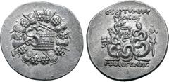 Roman Provincial C. Septimius T. f. AR Cistophoric Tetradrachm of Pergamum, Mysia. Menogenes, magistrate. Circa 57-55 BC. Serpent emerging from cista mystica; all within ivy wreath / Two serpents entw