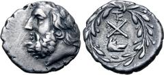 Greek Achaia, Achaian League AR Triobol or Hemidrachm. Argos, circa 195-188 BC. Laureate head of Zeus to left / Large monogram of the Achaian League; TK monogram above, wolf head to right below, all w