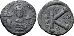 Byzantine Justinian I Æ 20 Nummi. Uncertain Italian mint (Perugia?). Dated RY 26 = AD 552/3. D N IVSTINIANVS P P AVC, helmeted and cuirassed bust facing, holding globus cruciger and shield; cross in r
