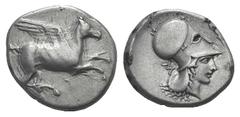 Corinthia, Corinth AR Stater. Corinthia, Corinth AR Stater. c. 405-345. Pegasos flying r. / Helmeted head of Athena r., dolphin above r. Ravel 921; BMC 387. 8.47g, 21mm, 11h. VF