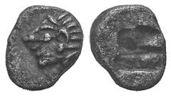Ionia, Kolophon AR Tetartemorion. Ionia, Kolophon AR Tetartemorion. late 6th C. Archaic head of Apollo l. / Incuse square punch. SNG Kayhan 343; SNG vA 1810. 0.17g, 6mm. Dark tone, EF