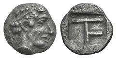 Ionia, Kolophon AR Tetartemorion. Ionia, Kolophon AR Tetartemorion. c. 450-410. Laureate head of Apollo r. / TE monogram within incuse square. Milne, Colophon 31; SNG Kayhan 358. 0.30g, 7mm, 9h. Toned