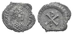 Justinian I AR Half Siliqua (?). Justinian I AR Half Siliqua (?). Ravenna, 552-565. Pearl-diademed bust r., wearing robe decorated with three pellets / Large Christogram within wreath. MIBE 77; DOC 33