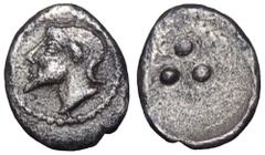 Sicily, Himera AR Tetras. Circa 470-450 BC. Bearded male head l., wearing ram's horn / Three pellets. Manganaro 1984, 27; HGC 2, 458. 0.17g, 8mm. Very rare. Very Fine.