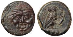 Sicily, Kamarina Æ Tetras. Circa 420-410 BC. Gorgoneion with tongue protruding / Owl standing r., grasping lizard. Westermark & Jenkins 195.1; CNS III, p. 57, 25; HGC 2, 547. 3.16, 14mm, 6h. Extremely