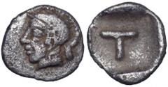Arkadia, Tegea AR Tetartemorion. Circa 423-400 BC. Helmeted head of Athena r. / T within shallow incuse square. BCD Peloponnesos 1721; HGC 5, 1054. 0.19g, 7mm, 10h. Very Fine. Extremely Rare.