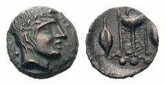 Sicily, Leontini Æ Tetras.Sicily, Leontini Æ Tetras. Circa 405-402 BC. Laureate head of Apollo right; leaf to left / Tripod; barley grains flanking, three pellets (mark of value) in exergue. 1.59g, 13