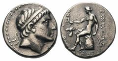 Seleukid Kings of Syria. Antiochos II AR Tetradrachm.Seleukid Kings of Syria. Antiochos II AR Tetradrachm. Aegeai, circa 261-246 BC. Diademed head right / Apollo seated left on omphalos, holding arrow