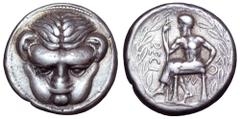Bruttium, Rhegion AR Tetradrachm. Circa 445-435 BC. Facing lion's head / Iocastos seated left holding staff in right hand, left hand resting on hip, RECI-N-OS around; all within laurel wreath. Herzfel