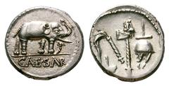 Julius Caesar AR Denarius. Julius Caesar AR Denarius. Military mint travelling with Caesar, 49-48 BC. Elephant advancing right, trampling on horned serpent / Emblems of the pontificate: simpulum, aspe