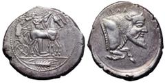 Sicily, Gela AR Tetradrachm. Circa 465-450 BC. Charioteer driving slow quadriga right, Ionic column behind, Nike flying above to crown horses, ear of corn in exergue / CELAΣ, forepart of man-headed bu