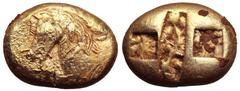 Ionia, Ephesos (?) EL Stater. Circa 575-560 BC. Forepart of bridled horse left, sunburst before; lotus flower on its back / Rectangular incuse punch between two square incuse punches, all with roughly