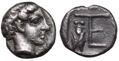 Ionia, Kolophon AR Tetartemorion. Circa 450-410 BC. Laureate head of Apollo right / TE monogram, cicada left; all within incuse square. Milne, Colophon 33; SNG Copenhagen -; SNG Kayhan 359. 0.30g, 6mm