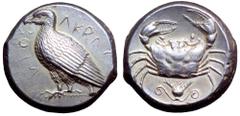 Sicily, Akragas AR Tetradrachm. Circa 460-446 BC. Sea eagle standing left on Ionic capital, AKRACANTOΣ around / Crab; flower with spiralled tendril ornaments below; all within shallow incuse circle. S