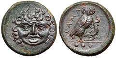 Sicily, Kamarina Æ Tetras. Circa 420-405 BC. Gorgoneion with tongue protruding / Owl standing right, grasping lizard; three pellets below ground line. CNS III, 8; SNG ANS 1121-1124. 4.12g, 18mm, 10h. 