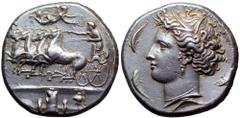 Sicily, Syracuse AR Dekadrachm. Time of Dionysios I, circa 405-400 BC. Reverse die signed by Euainetos. Charioteer driving galloping quadriga to left, holding kentron in right hand, reins in left; abo