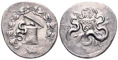 Lydia, Tralleis AR Cistophoric Tetradrachm. Circa 140-135 BC. Cista mystica with serpent; all within ivy wreath / Two serpents entwined around bow and bowcase; thunderbolt above, TPAΛ to left, eagle t