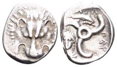 Dynasts of Lycia, Perikles AR Third Stater. Circa 380-360 BC. Facing lion's scalp / Triskeles; Dolphin right in upper field; Female head facing in lower left field; legend around. SNG Copenhagen -; SN