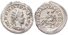 Philip II AR Antoninianus. Rome, AD 247-249. IMP PHILIPPVS AVG, radiate and draped bust right / LIBERALITAS AVG III, Philip I and Philip II seated left on curule chairs. RIC 230. 3.32g, 23mm, 1h. Very