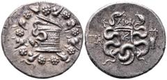 Lydia, Tralleis AR Tetradrachm. Circa 166-67 BC. Cistophoric type. Dion, magistrate. Cista mystica with serpent within ivy wreath / Two serpents entwined around bow and quiver; ∆ION above, TRAΛ to lef