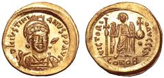 Justinian I AV Solidus. Constantinople, AD 527-538. D N IVSTINIANVS P P AVG, helmeted, cuirassed bust three-quarters facing, shield with horseman device on left shoulder, spear across right shoulder /