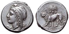 Sicily, uncertain Punic military mint AR Tetradrachm. Circa 320-310 BC. Head of 'Dido-Tanit' to left, wearing Phrygian cap encircled with plain diadem tied above forehead / Lion walking to left, head 
